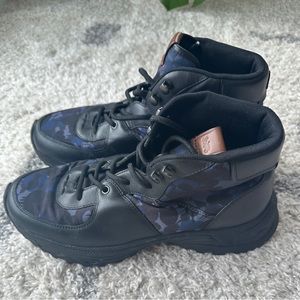 Coach boots with Camo pattern and real leather trim. Lightly worn